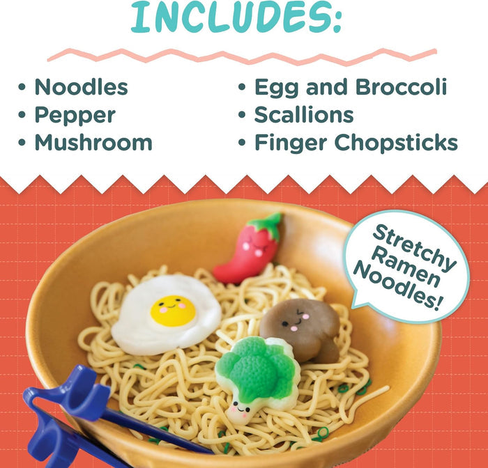 Toy ramen bowl with stretchy tan noodles, smiley-faced toppings, and blue finger chopsticks with a list of inclusions.