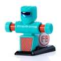 Teal robot toy with blue visor, orange gear arms, and red patterned chest on a black base with an FB logo.