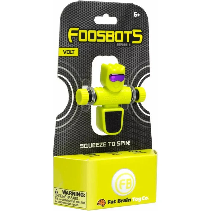 Bright yellow blocky robot with a purple visor in black and lime green Foosbots Series 2 blister packaging.