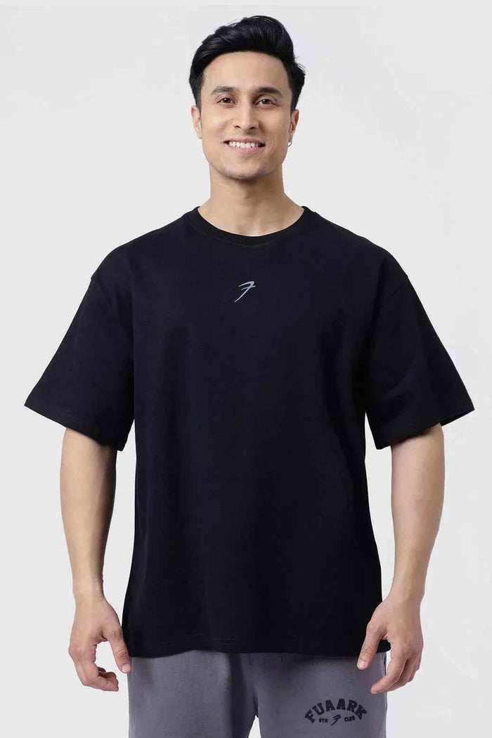 Black Fortitude oversized T-shirt by Fuaark Nz, showcasing a relaxed fit and casual style in the image.