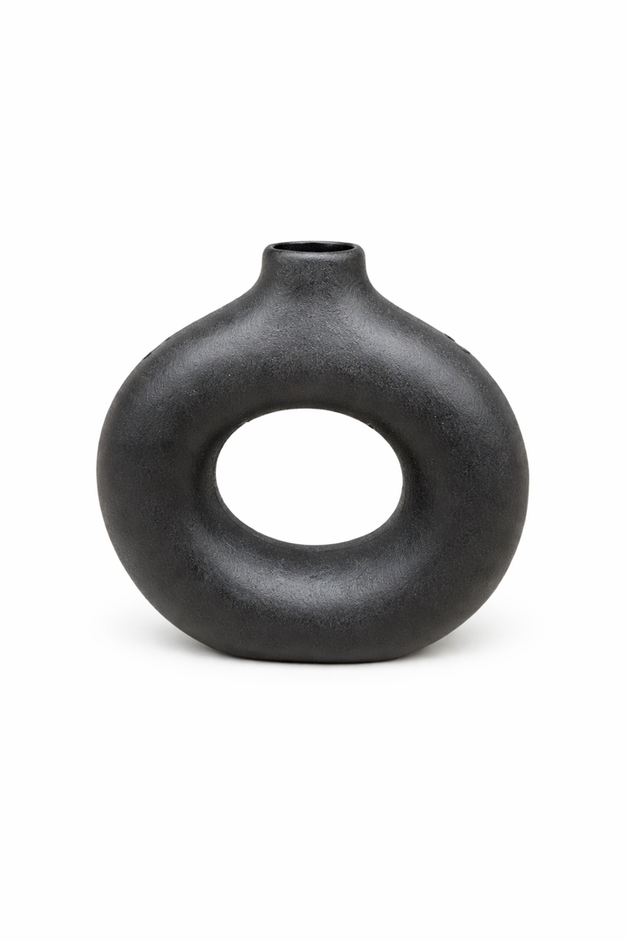 Black ceramic sculptural donut vase by Nest & Stem Homewares, featuring a modern, rounded design perfect for contemporary decor.