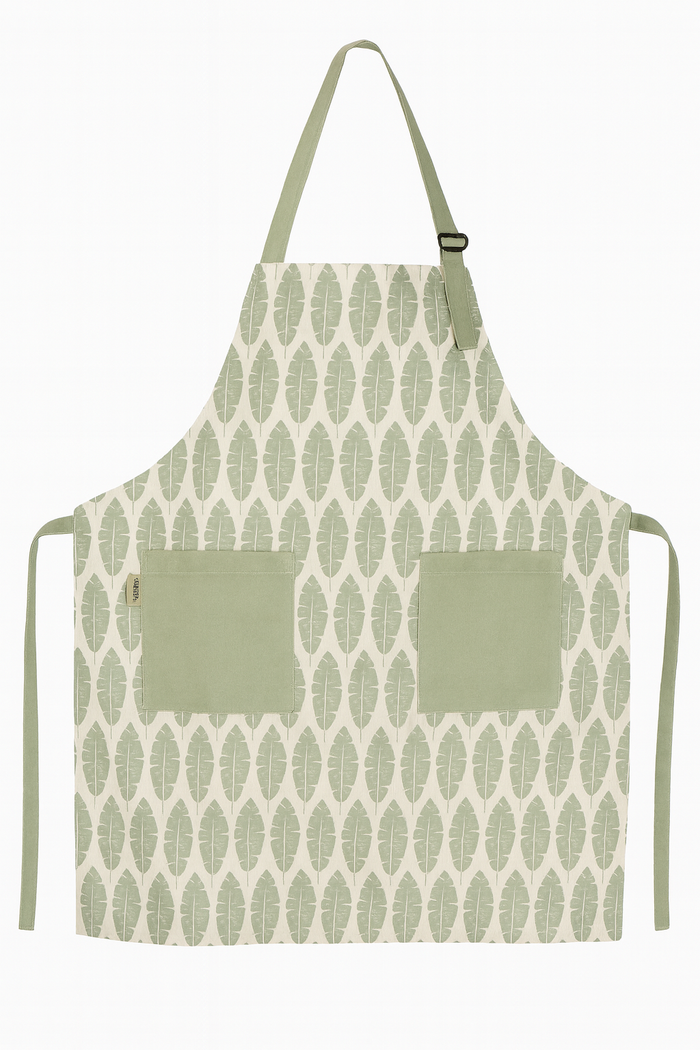 Nest & Stem Homewares Frankly Cotton Classic Green and White Leaves apron with leafy pattern on a white background.