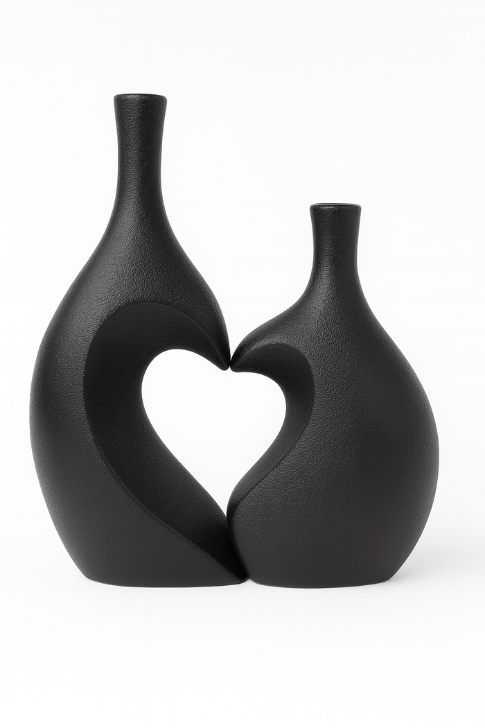 Pair of black ceramic vases with heart-shaped unity design by Nest & Stem Homewares, perfect for elegant home decor.