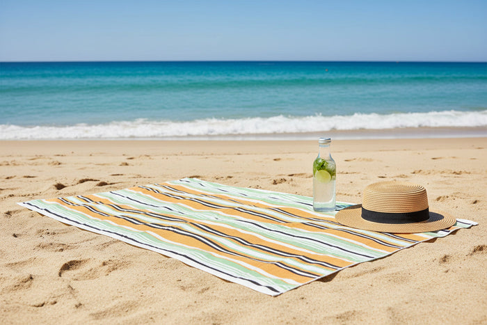 Orange and green quick-dry cotton beach towels by Nest & Stem Homewares, sandless design, 100x180cm, vibrant color options.