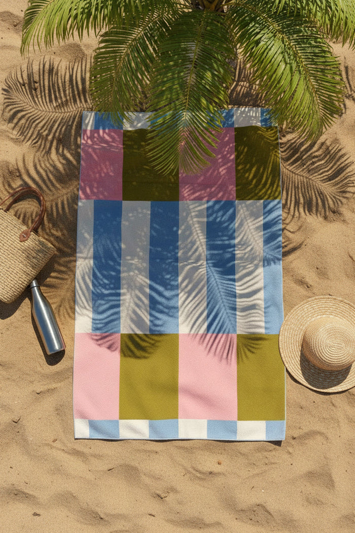 Nest & Stem Homewares cotton quick dry beach towel in white, green, pink, and blue with 100x180cm size laid flat.