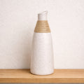 Speckled ceramic rope vase by Nest & Stem Homewares, featuring a textured design and neutral tones, ideal for decorative floral arrangements.