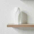 Nest & Stem Homewares Frankly Cotton Spiral Ceramic Vase with a unique spiral design and neutral cotton color, perfect for home decor.