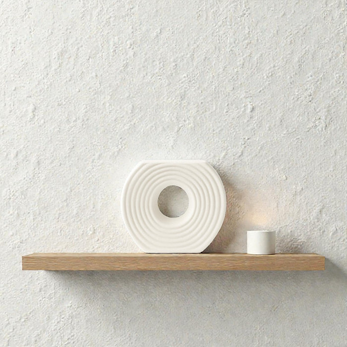 White circular ceramic vase with textured finish, designed by Nest & Stem Homewares, ideal for modern home decor.