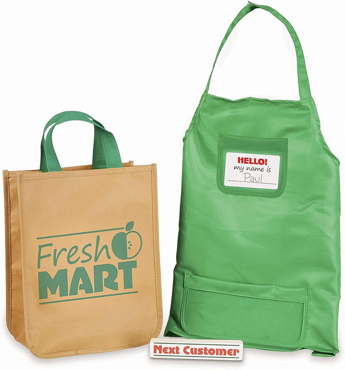Tan grocery bag with green logo, green apron with Paul name tag, and white Next Customer checkout divider bar.