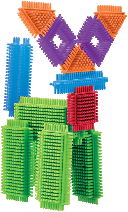 Toy reindeer made of colorful interlocking bristle blocks in green, red, blue, orange, and purple.