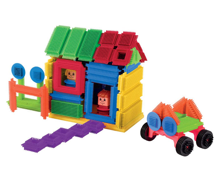 Colorful bristle block house and car set with two small character figures on a white background.