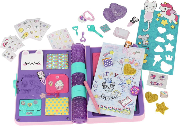 Open purple secret journal toy with stickers, keys, charms, and a glittery pencil spread around its hidden compartments.