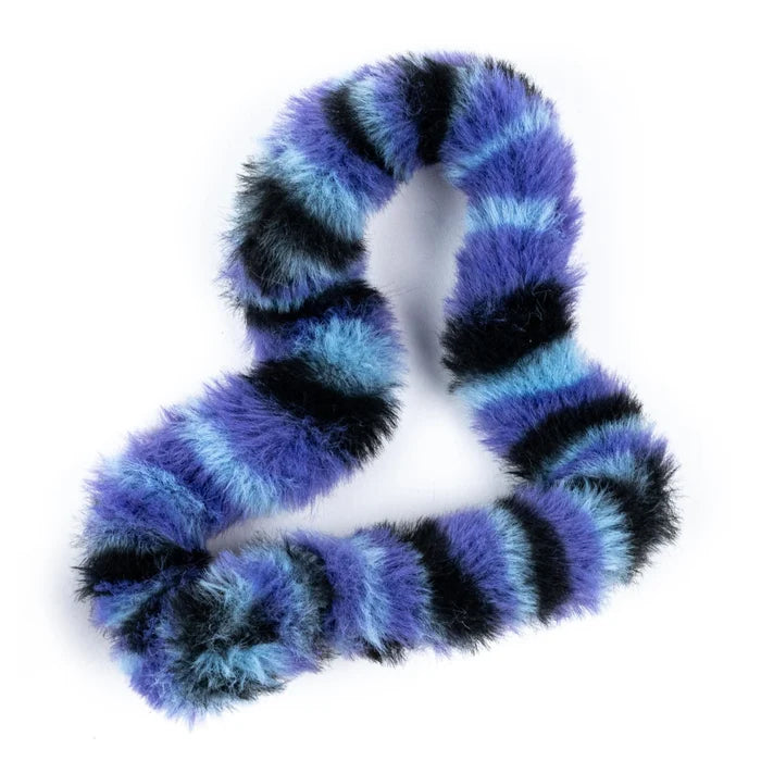 Fuzzy, striped toy in purple, light blue, and black, twisted into a loop on a white background.
