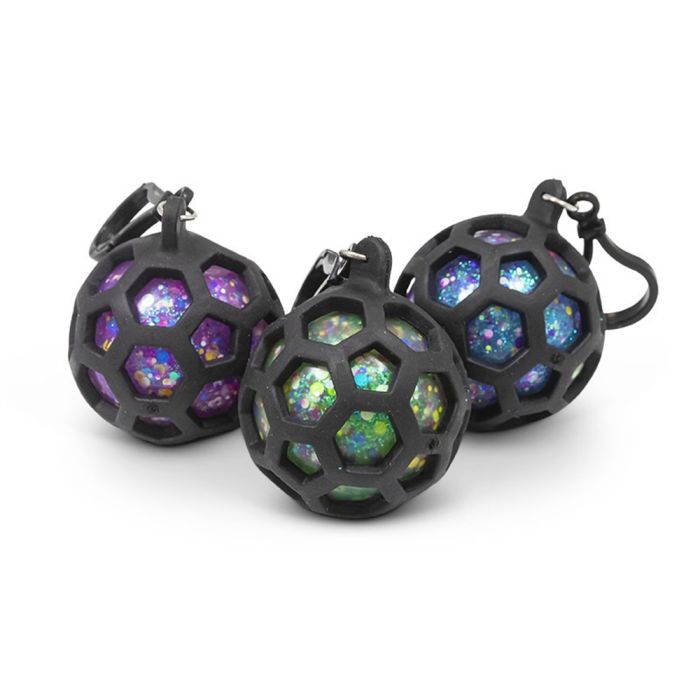 Three squish balls in black honeycomb cages with purple, green, and blue glitter interiors and attached key clips.