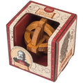 Wooden interlocking sphere inside a vintage-style cream and red box featuring star charts and a portrait of Galileo.