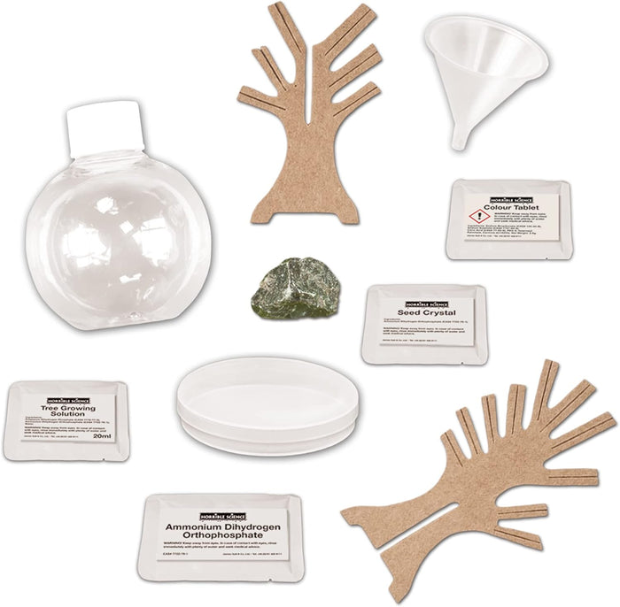 Horrible Science kit with cardboard trees, a clear bottle, white funnel, green rock, tray, and four labeled packets.