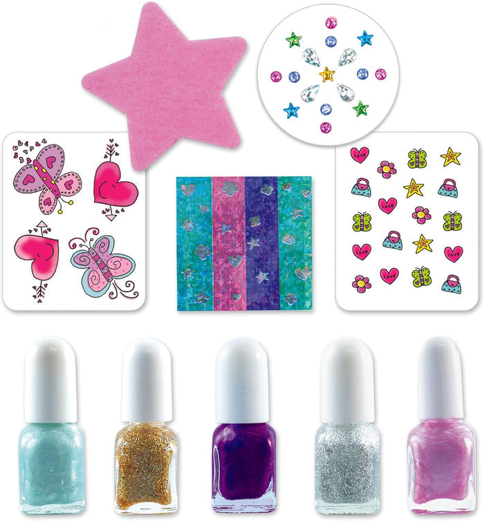 Five colorful nail polishes, a pink star nail file, and sheets of nail stickers, gems, and holographic patterns.