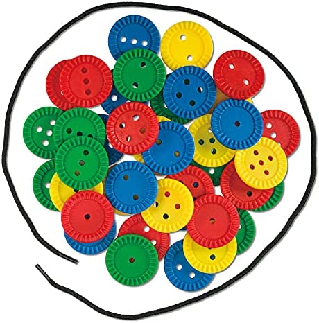 Colorful red, blue, green, and yellow ridged plastic buttons with holes, surrounded by a black lacing string.