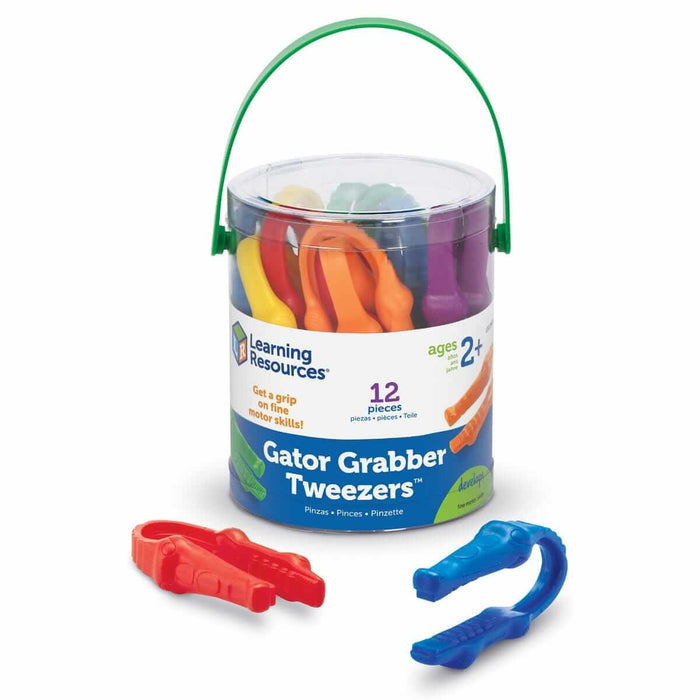 12 colorful alligator-shaped tweezers in a clear bucket with a green handle. Red and blue tweezers sit in front.