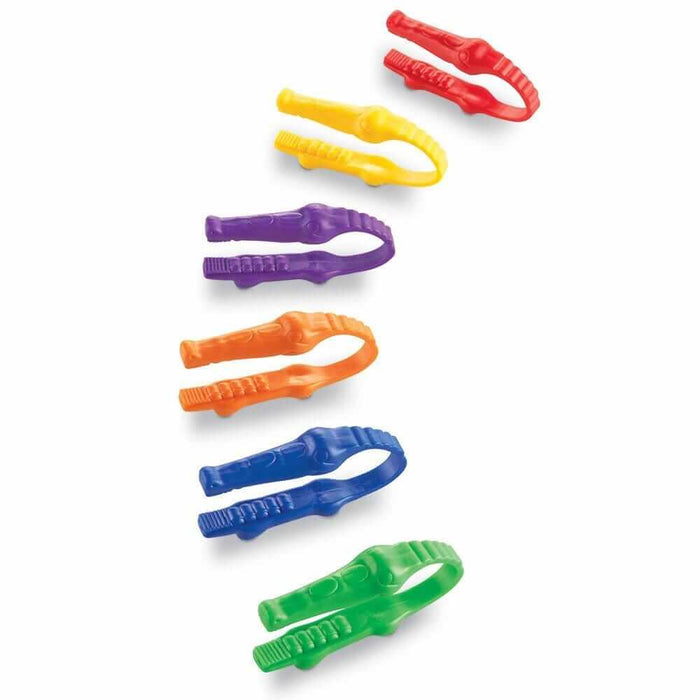 Six plastic alligator-shaped tweezers in red, yellow, purple, orange, blue, and green with textured grips.