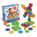 A 60-piece set featuring vibrant gears, green base plates, and a tall assembled gear tower next to the product box.