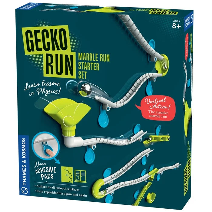Vertical marble run toy box showing white tracks and lime green funnels attached to a wall by blue adhesive pads.