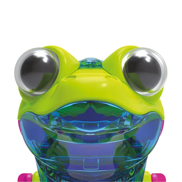 Close-up of a lime green toy robot head with large bulbous eyes and a translucent blue mechanical jaw.