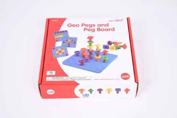 Red and white toy box showing an illustration of colorful, shaped plastic pegs stacked on a blue square pegboard.