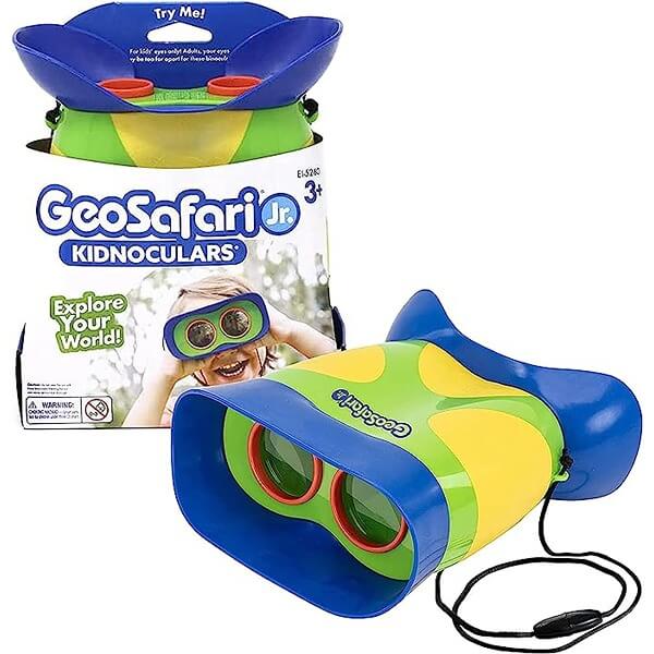 Chunky blue, green, and yellow toy binoculars with a black strap, shown next to their white retail packaging.