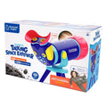 Box for a blue and red talking telescope toy on a tripod, featuring science facts and a woman in a flight suit.