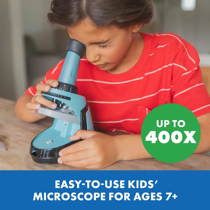 Child using a teal microscope with a green 400X badge. Blue banner says easy-to-use kids' microscope for ages 7+.