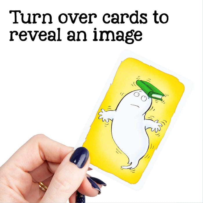 A hand holds a game card showing a cartoon white ghost balancing a green book on its head against a yellow background.