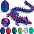 Large iridescent purple and blue 3D printed dragon with matching scaly egg and a row of six multi-colored eggs.