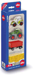 Blue Siku box featuring a white loader, green tractor, red trailer, and yellow toy grain.