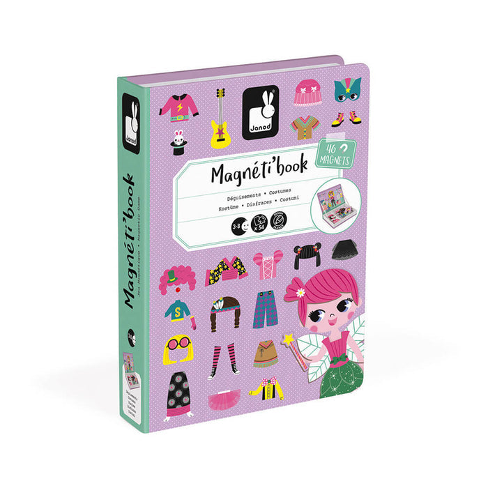 Purple book-shaped toy box featuring colorful illustrations of magnetic costumes, accessories, and a fairy girl.