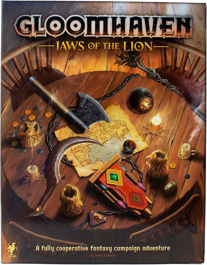 Fantasy board game box showing a top-down view of an axe, sickle, map, and coins on a wooden table in warm light.
