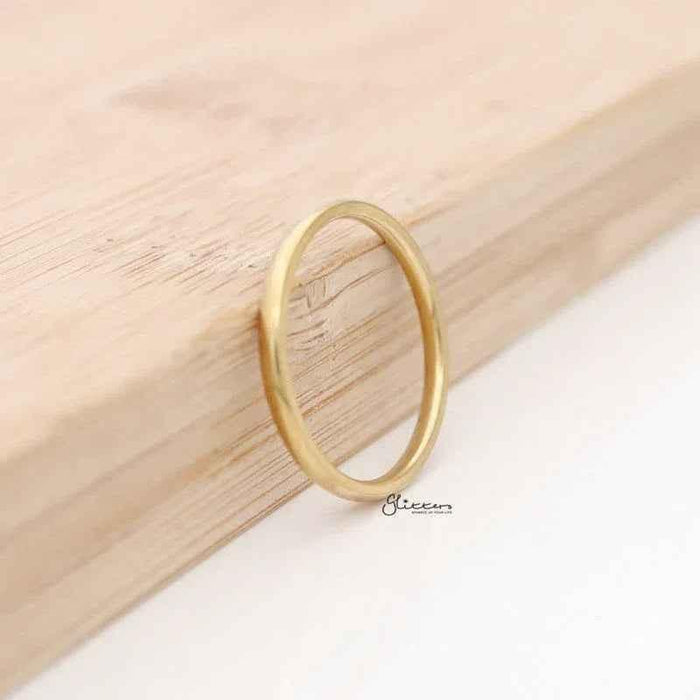 Gold plated stainless steel ring with a 2mm wide glossy mirror finish, plain band design, by Glitters.