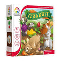 White board game box featuring a colorful illustration of bunnies and a mole gathering vegetables in a garden.