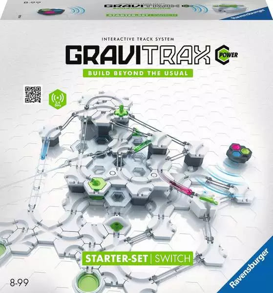 White toy box showing an intricate marble run with green accents and silver tracks on a white hexagonal grid.