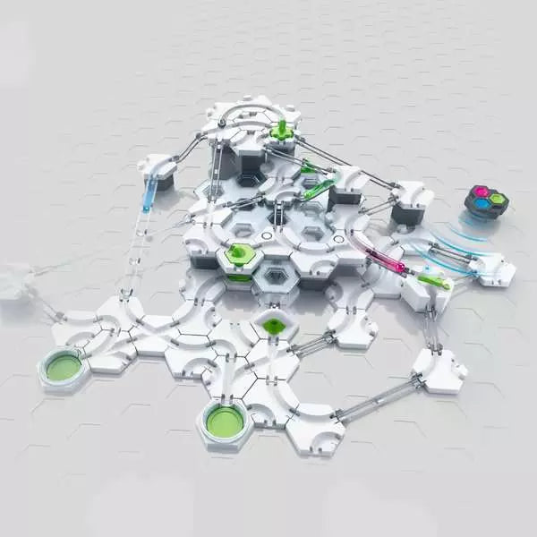 Intricate multi-level marble run with white hexagonal tiles, green switches, and glowing spheres on silver tracks.