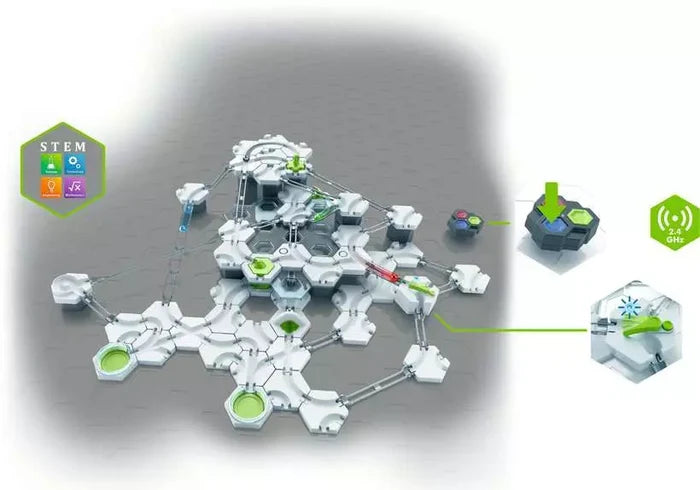 Modular marble run with white hexagonal tracks, green accents, a remote control, and a wireless motorized switch.