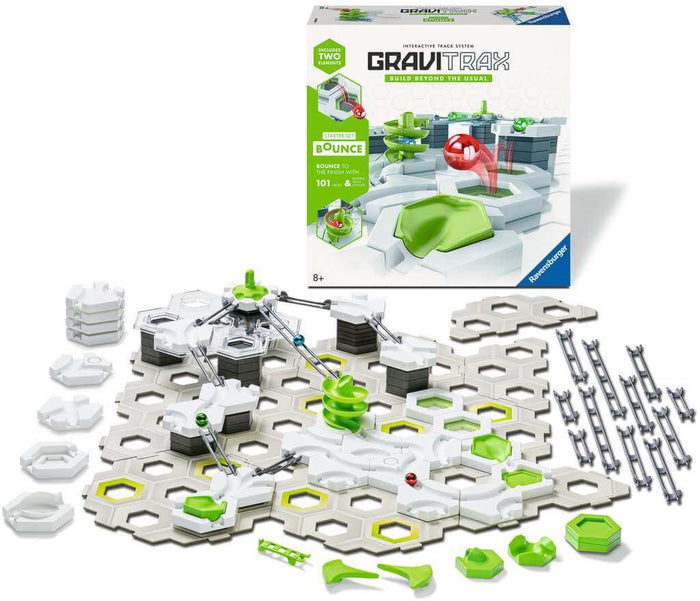 Marble run kit with white hexagonal plates, green tracks, and a spiral tower next to its illustrated white product box.