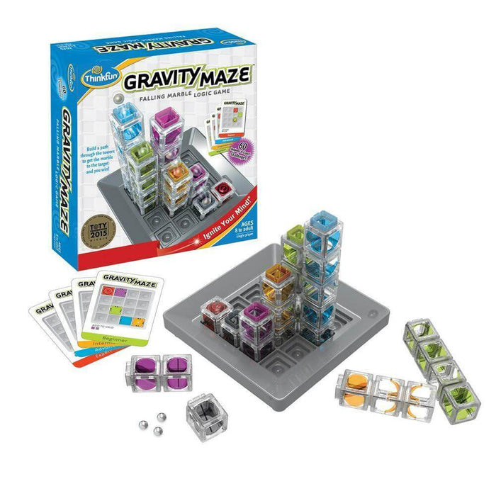 Logic game with colorful transparent towers, a grey base grid, cards, and silver marbles next to the product box.