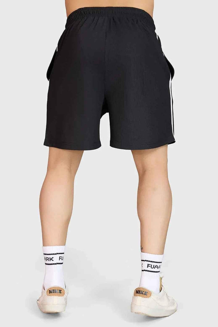 Fuaark Nz Grit Training Shorts for men, black athletic shorts designed for intense workouts and active training sessions.