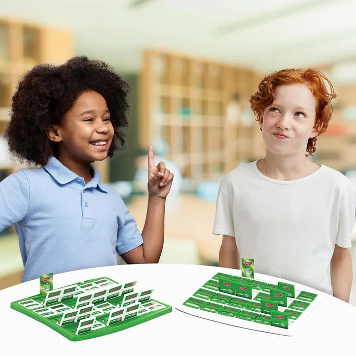 Two children play a football-themed guessing game with green flip-up card boards on a white table.