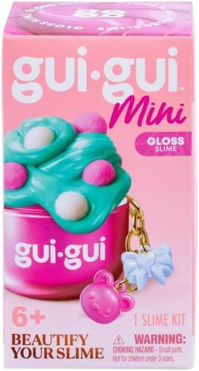 Pink box featuring teal gloss slime in a pink jar and a keychain with pink mouse and blue bow charms.