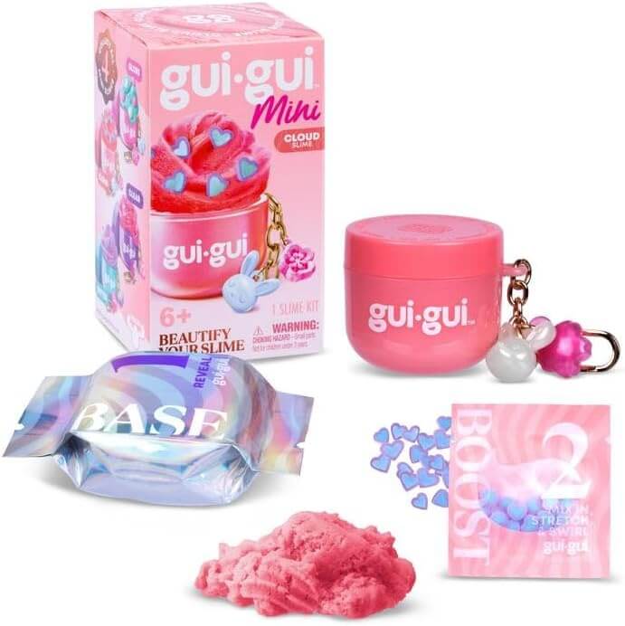 Pink cloud slime kit box, jar keychain with charms, base and boost packets, blue heart confetti, and pink slime.