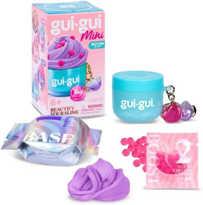 Purple slime kit with blue jar keychain, pink foam beads, holographic packets, and colorful retail box.