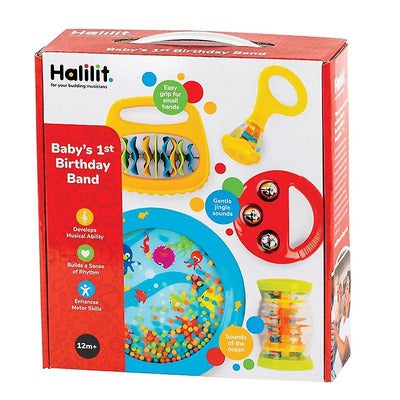 Red box displaying colorful toddler instruments: a blue ocean drum, red tambourine, yellow rattles, and a rainmaker.