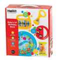 Red box displaying colorful toddler instruments: a blue ocean drum, red tambourine, yellow rattles, and a rainmaker.